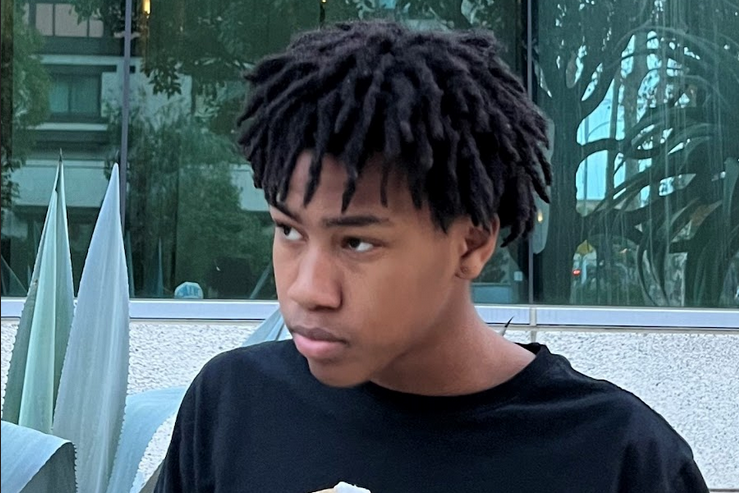 Rich Amari looking to the side